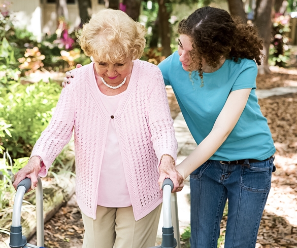 Woman assisting an elderly woman using a walker. re?id=2758
