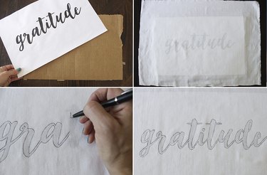 Tracing gratitude text onto fabric with pen.