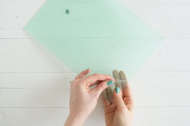 Peeling protective plastic from plexiglass