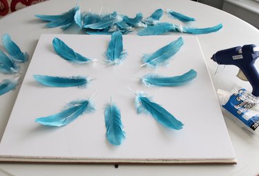 Position first layer of feathers