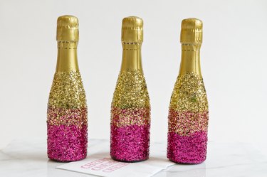 Glitter mini-champagne bottles.