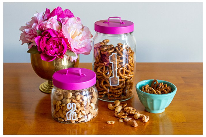 Etched glass jars filled with snacks