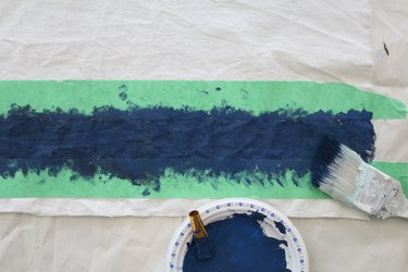 Dab paint in between taped surface.